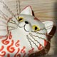 red and white ceramic cat sculpture