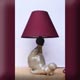 base de lampe en forme d'un hippopotame qui fait des galipettes