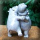 pair of dancing ceramic hippos