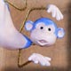 blue hanging monkey sculpture