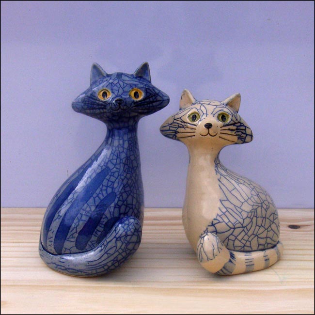 blue ceramic cat sculptures