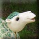 green and white camel sculpture